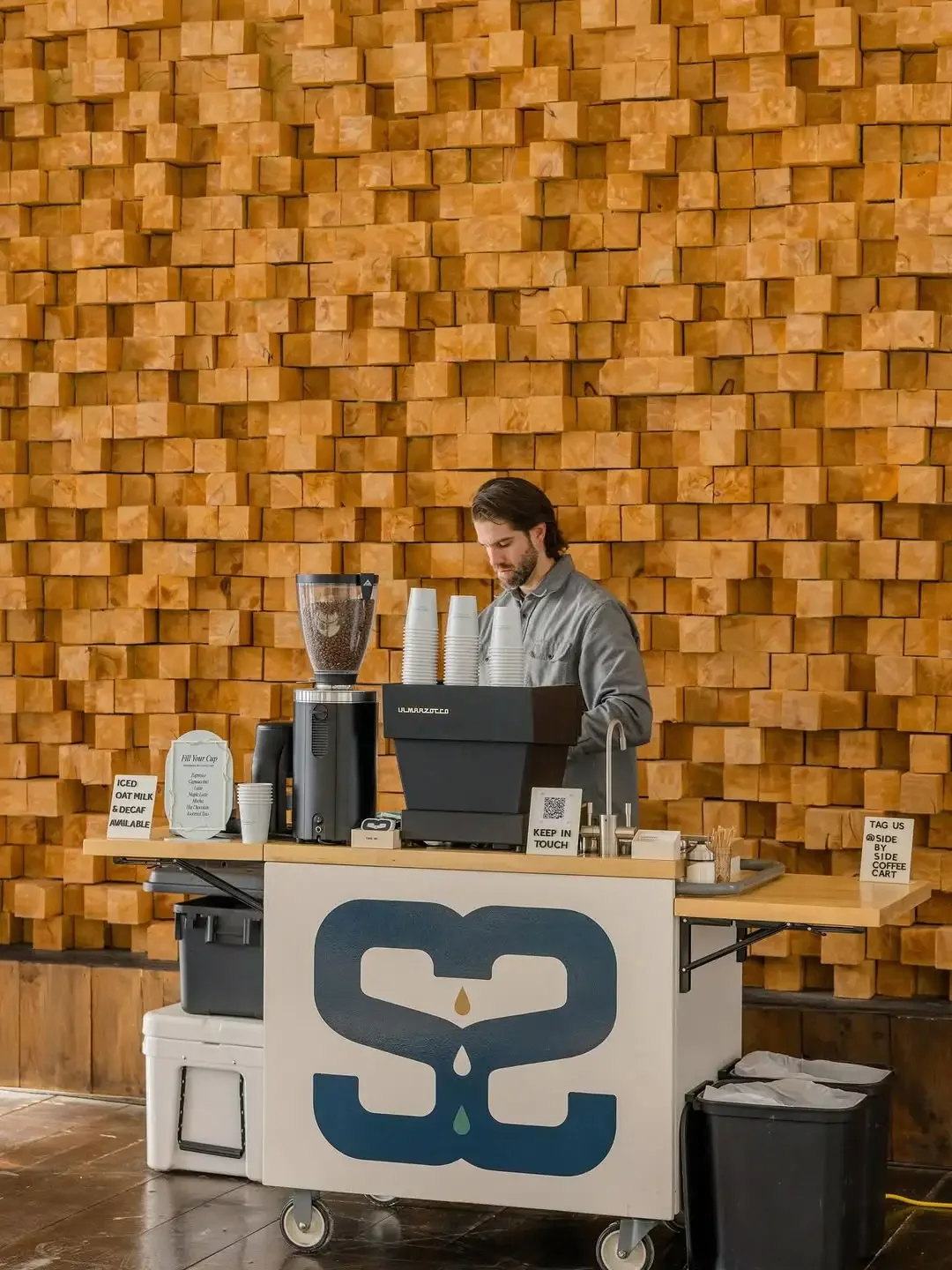 Kenny preparing coffee at the mobile espresso cart